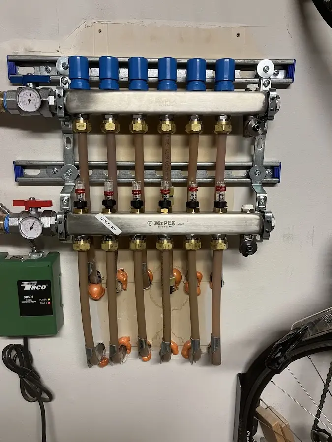 Plumber performing Gas Line Installation at a residential property in Woodhull